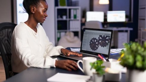 African mechanical designer working computer late night doing overtime finish project 482257 5389