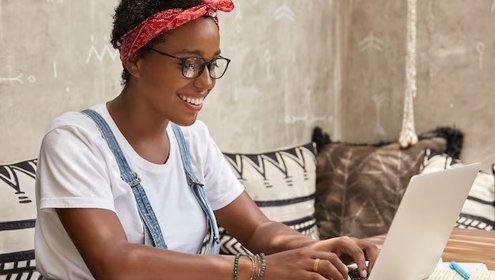 Positive young lady freelancer eyewear keyboards information laptop computer 273609 44955