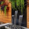 Board and batten farmhouse with multilevel native plantings