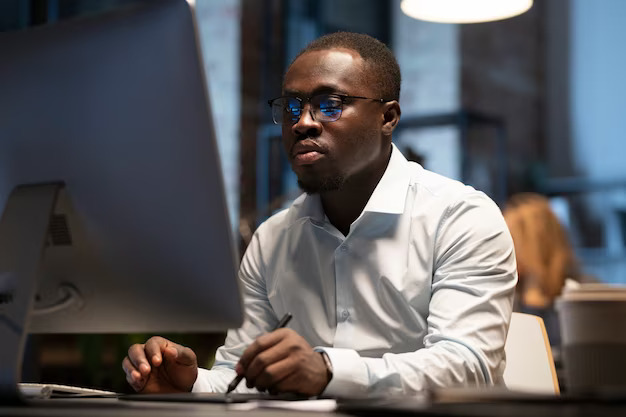 Black man working with computer 23 2149370567