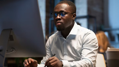 Black man working with computer 23 2149370567