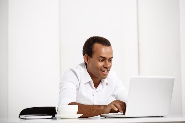 Young successful businessman typing laptop sitting workplace 176420 1231