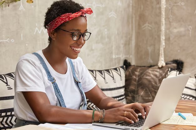 Positive young lady freelancer eyewear keyboards information laptop computer 273609 44955